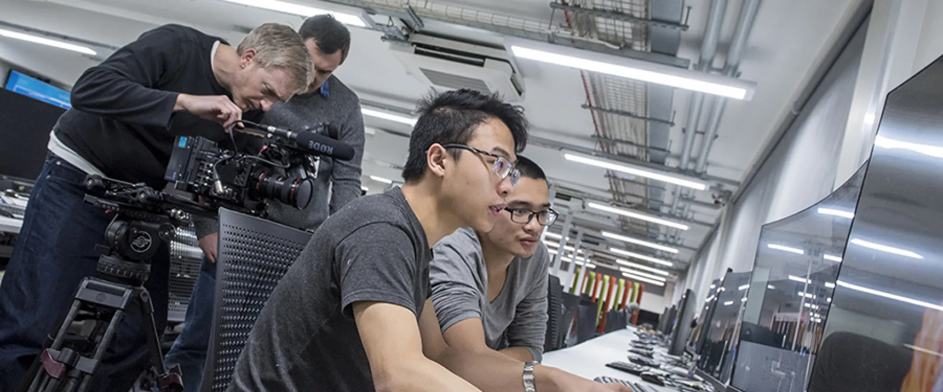 Developers looking at a computer screen